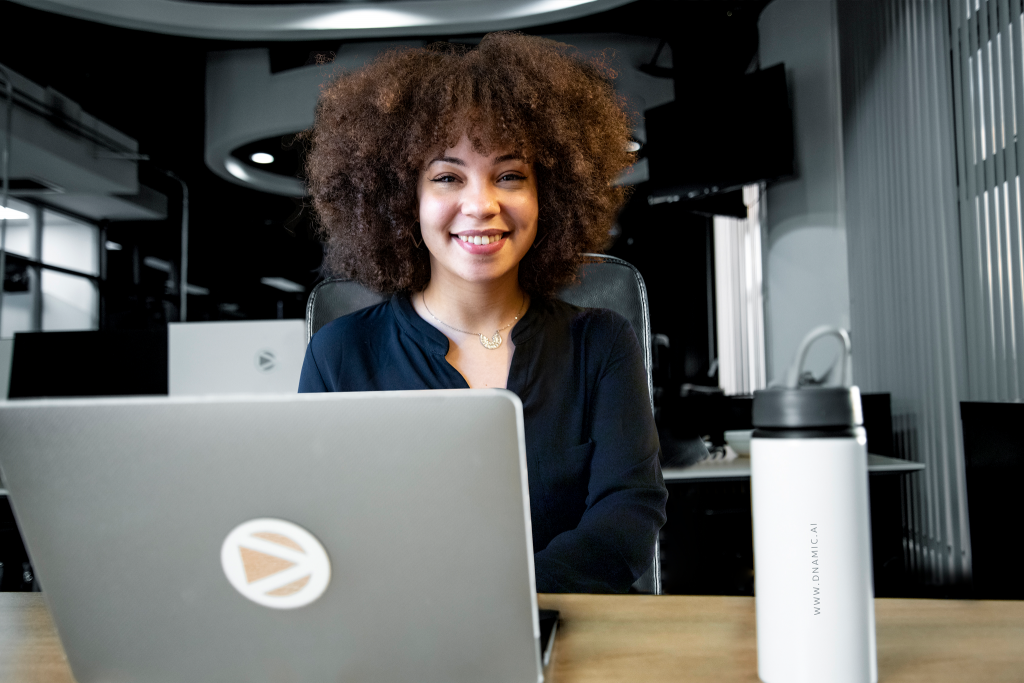 DNAMIC's data analyst working on data strategies on her laptop