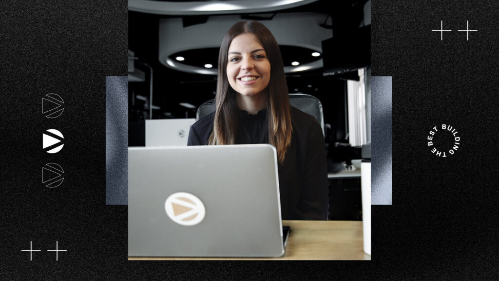 a women looking a laptop and smiling