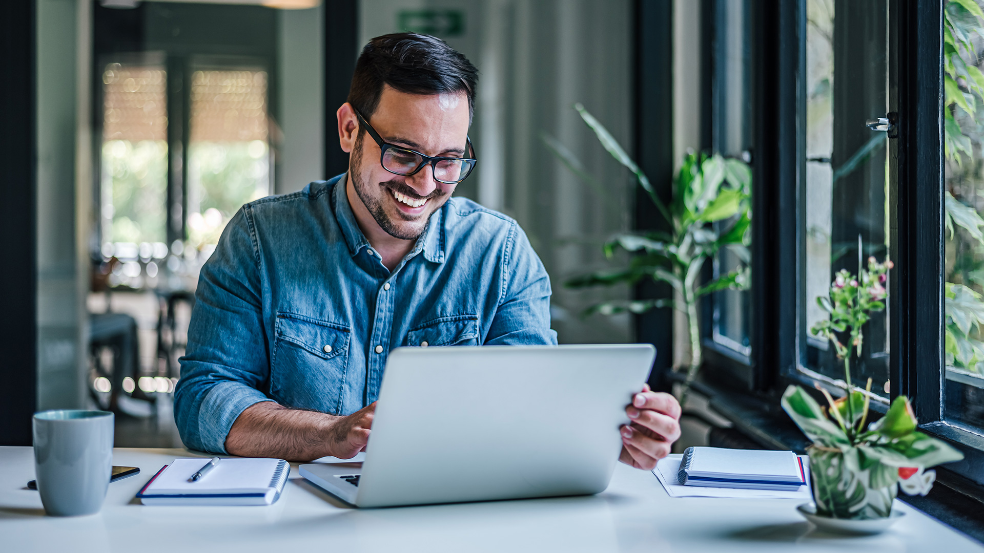 man in front of a laptop